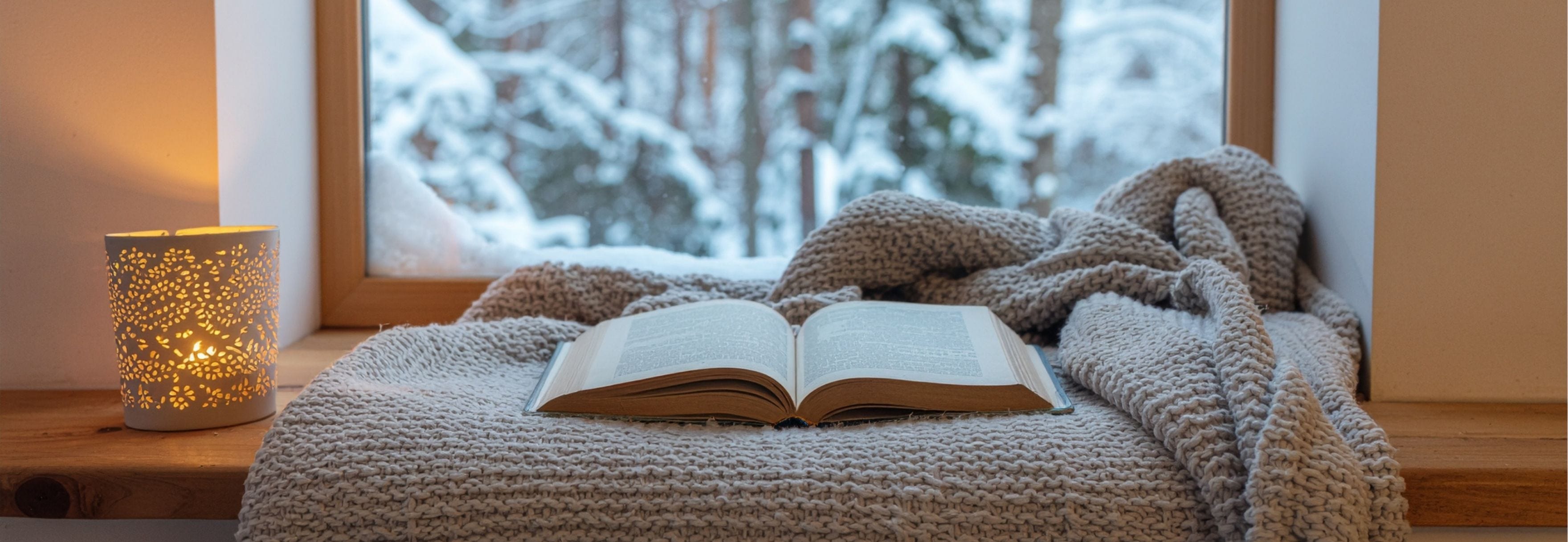 book on a windowsill in winter