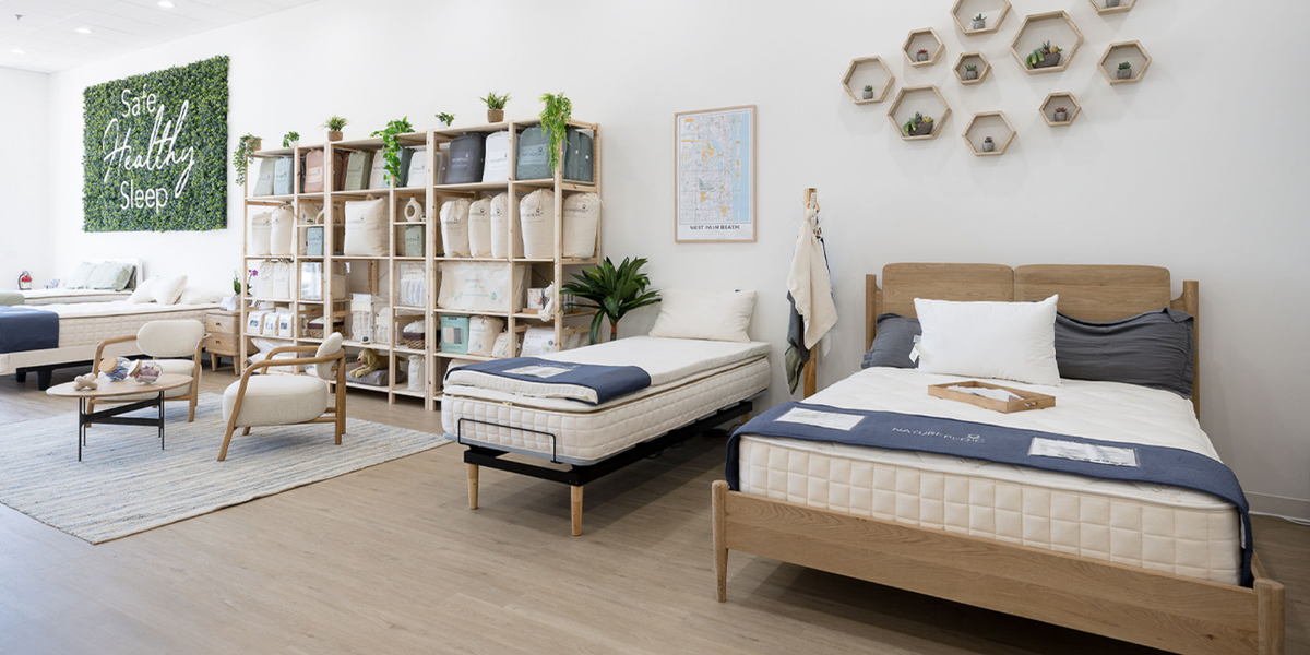 Naturepedic mattress store with different mattress sizes on display