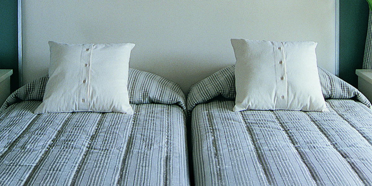 two twin beds pushed together to make a king bed