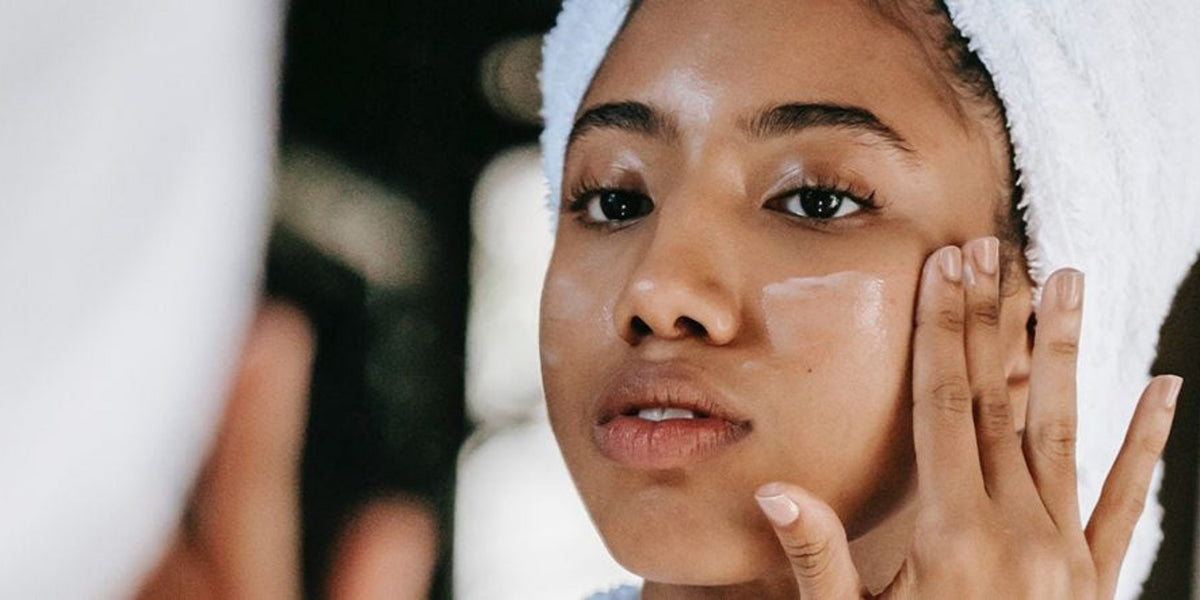 woman applying face cream