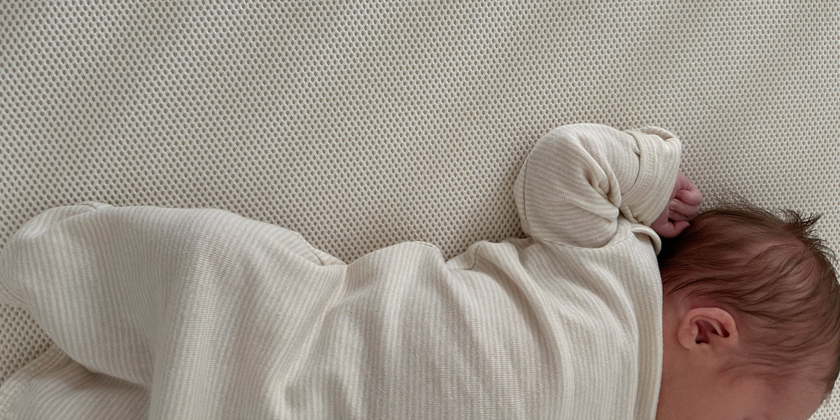 infant baby on a breathable crib mattress