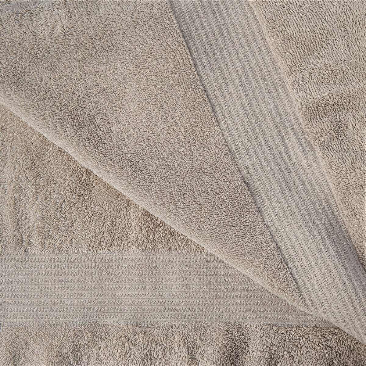 Close-up of a beige towel with textured surface #color_taupe