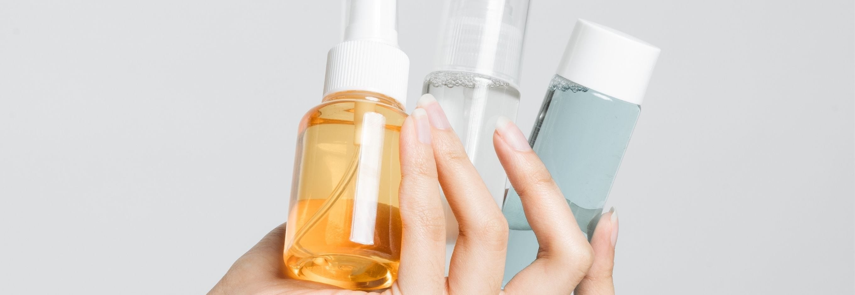 Person spraying an air freshener that contains phthalates
