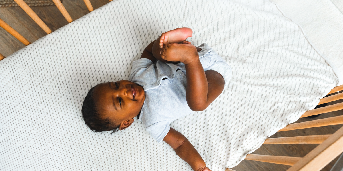 Baby awake and happy in crib 