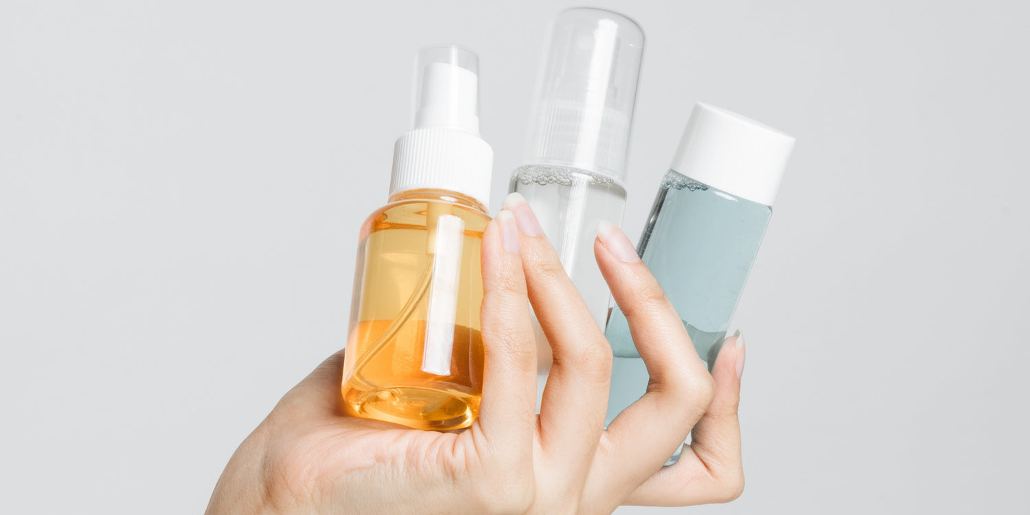 Person spraying an air freshener that contains phthalates