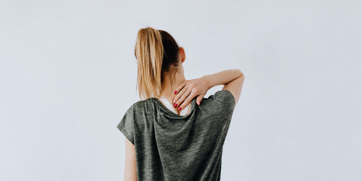 Back view of a woman having back pain