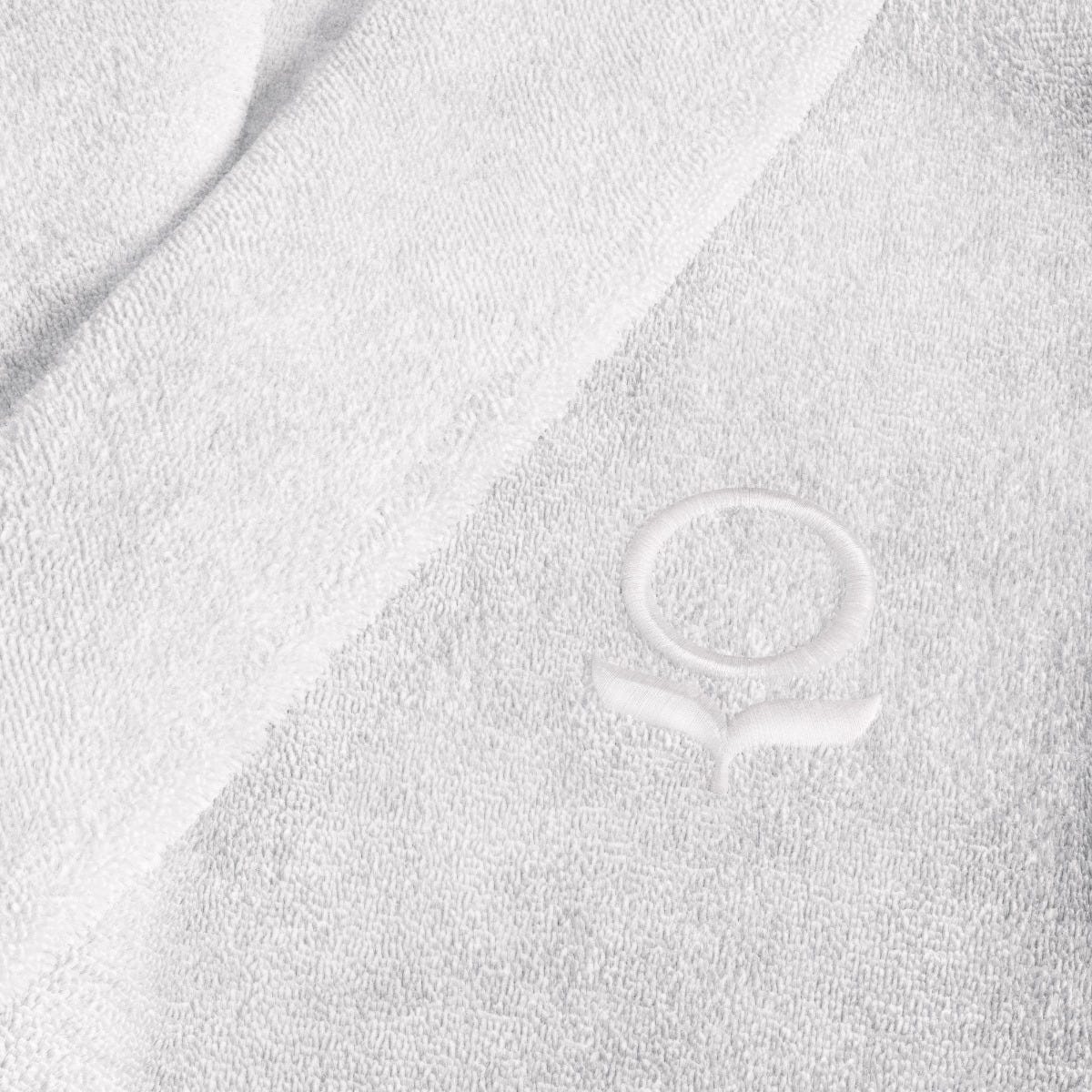 Close-up of a white robe with a logo on it #color_arctic snow