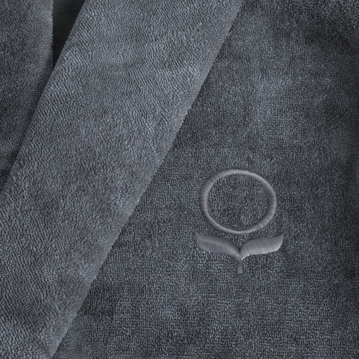 Close-up view of a gray robe with a logo #color_smokey slate