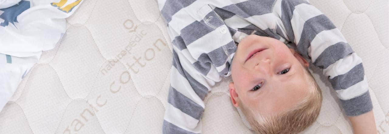 Kid laying on a NP mattress