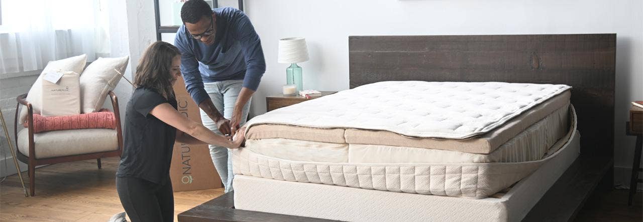 couple assembling naturepedic eos organic mattress