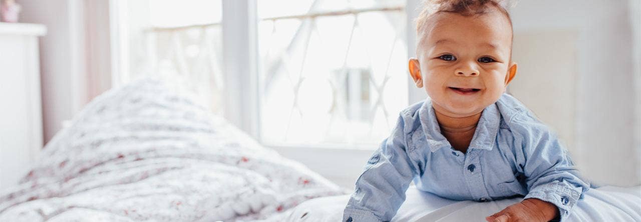 Wide awake and smiling toddler boy