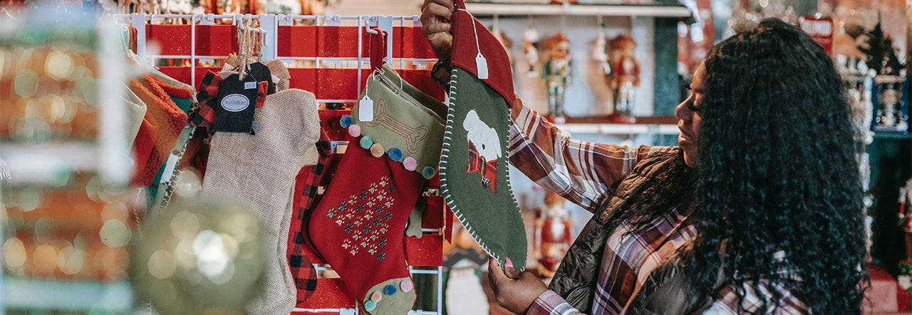 Woman admiring a holiday sticking in the store