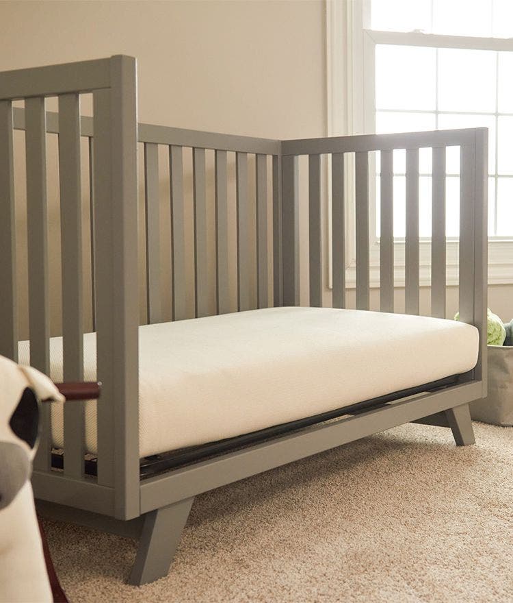 nursery with crib and breathable crib mattress