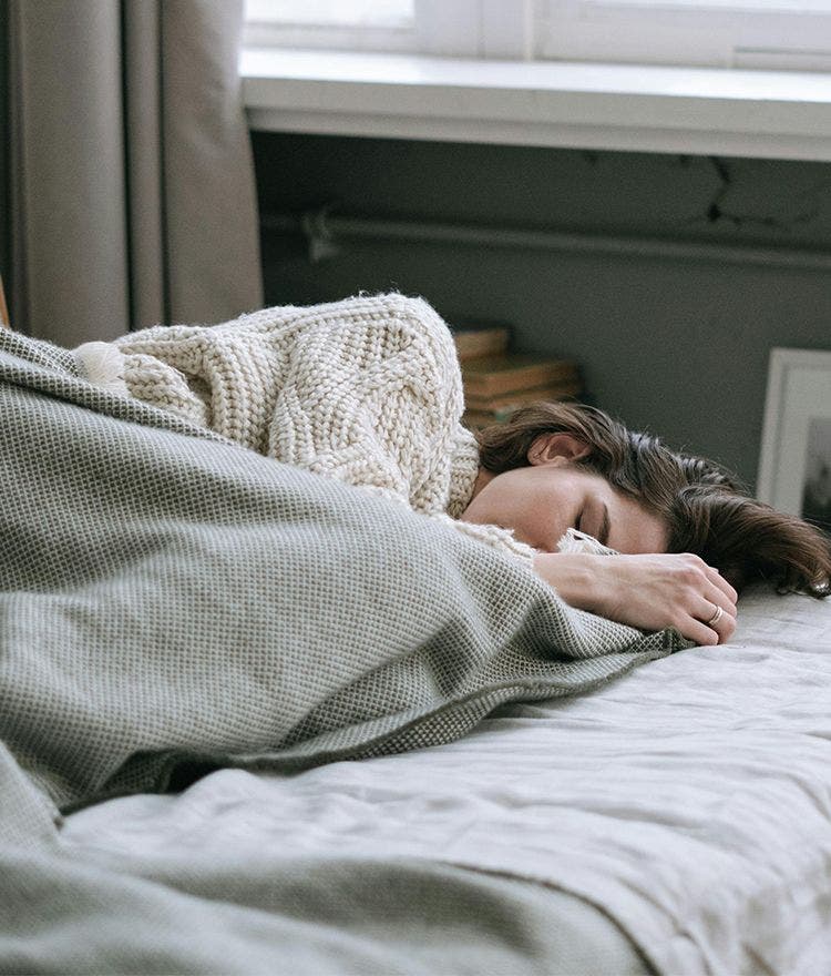 person sleeping on mattress in daylight