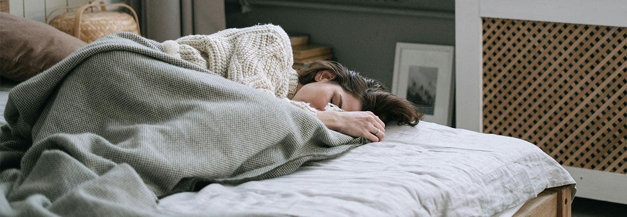 person sleeping on mattress in daylight