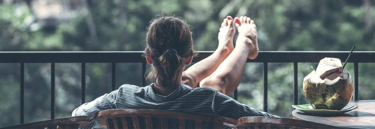 woman relaxing on balcony