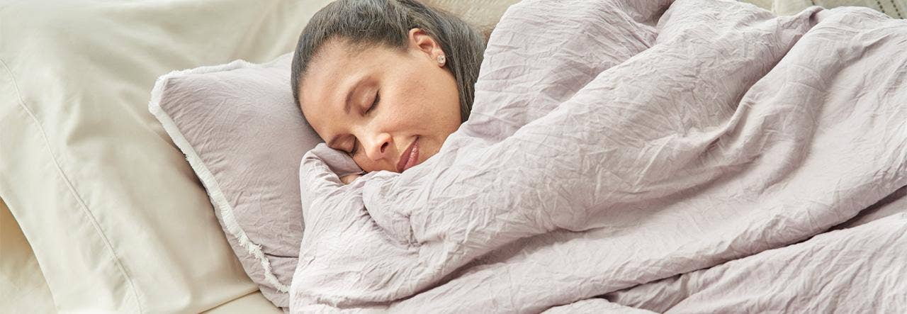 Woman sleeping on Naturepedic Halcyon Organic Mattress