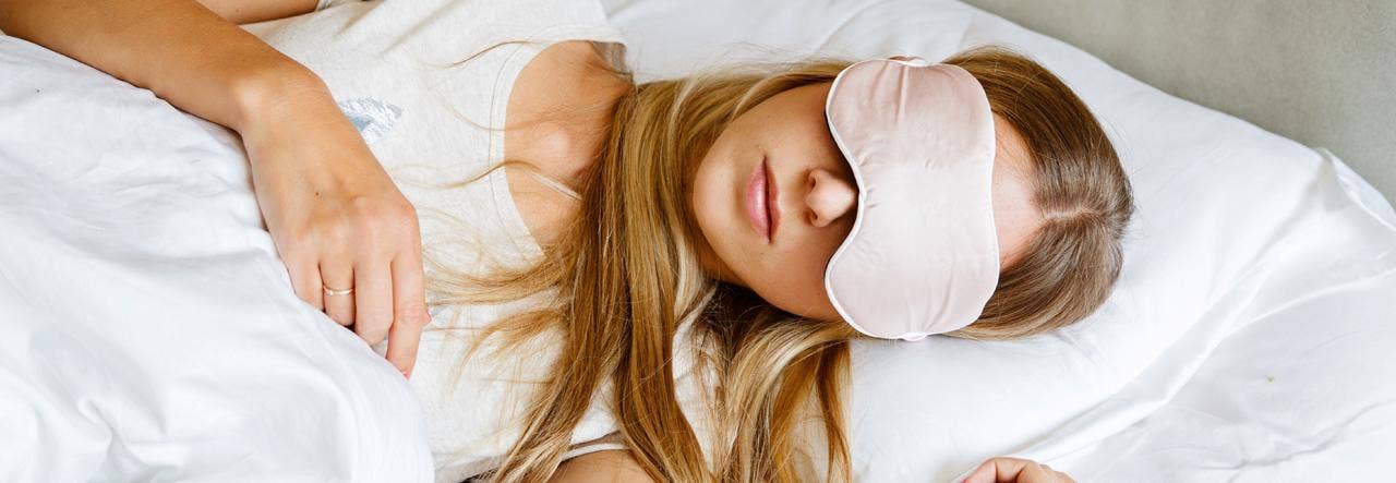 woman sleeping with sleep mask on