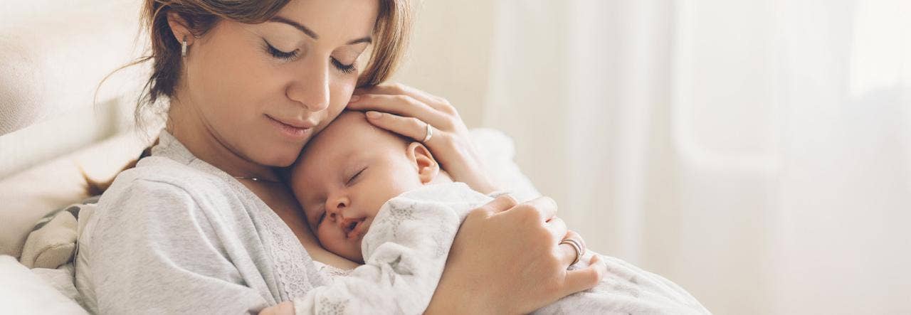 baby sleeping on mom