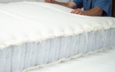 Girl writing a letter on mattress