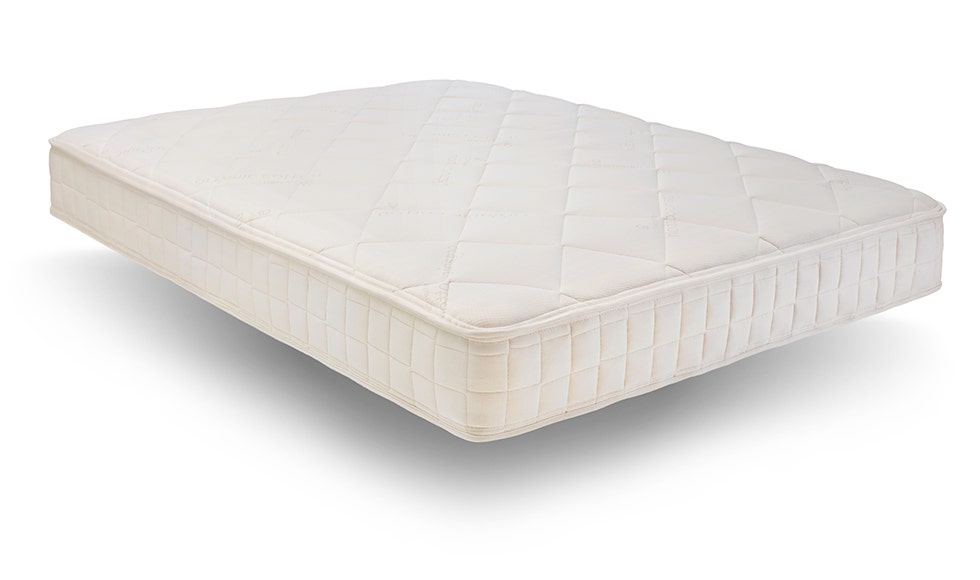 Angled shot of mattress on white background