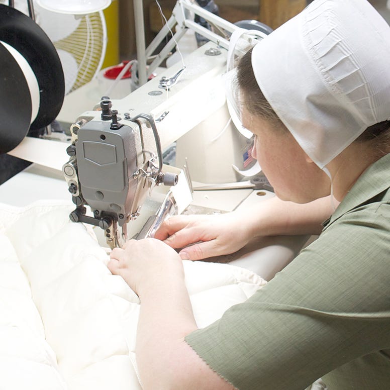 Close-up of Amish woman sewing