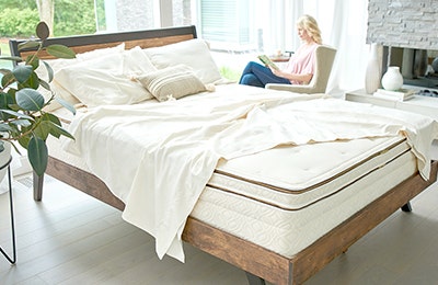 Bed with sheets draped across