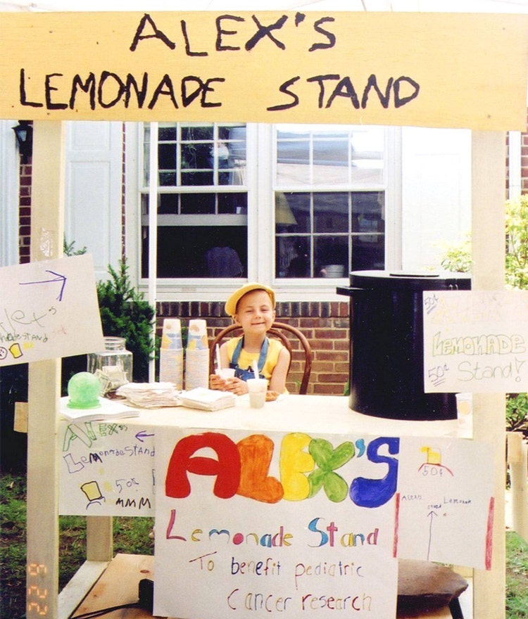 Alexandra “Alex” Scott sitting at her lemonade stand