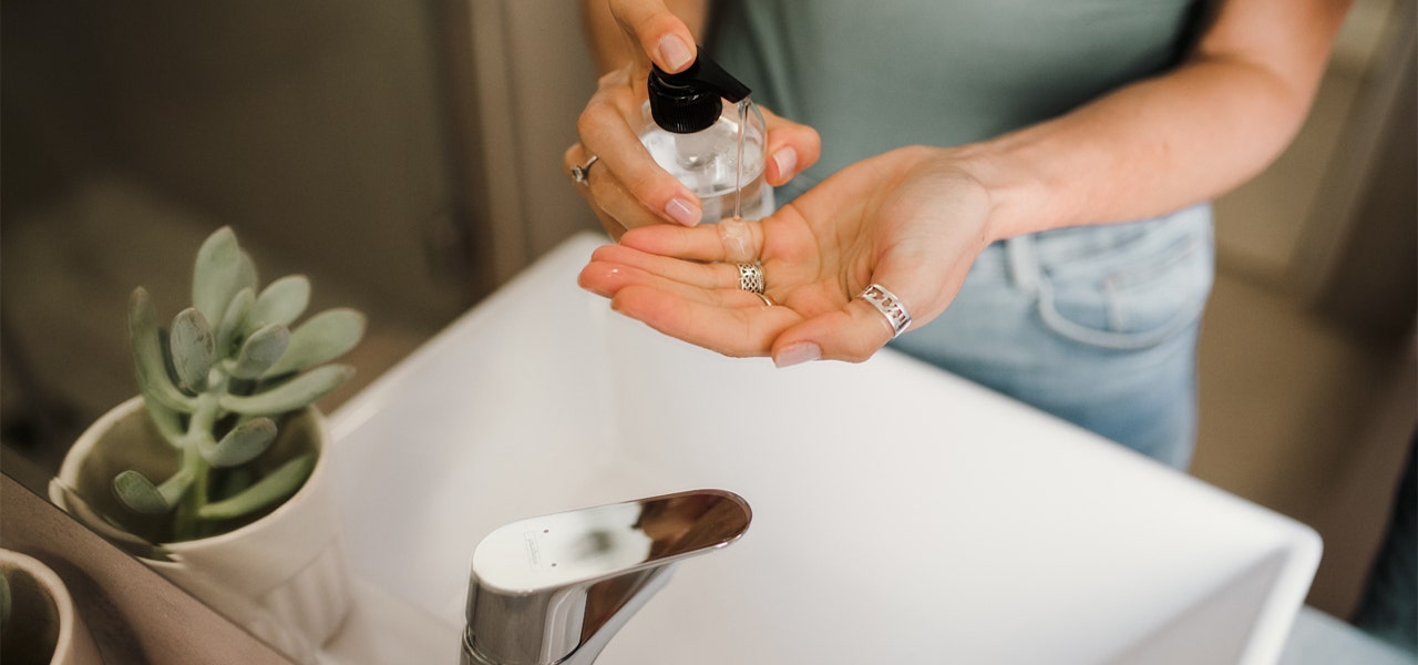 Overhead image of young woman washing her hands 