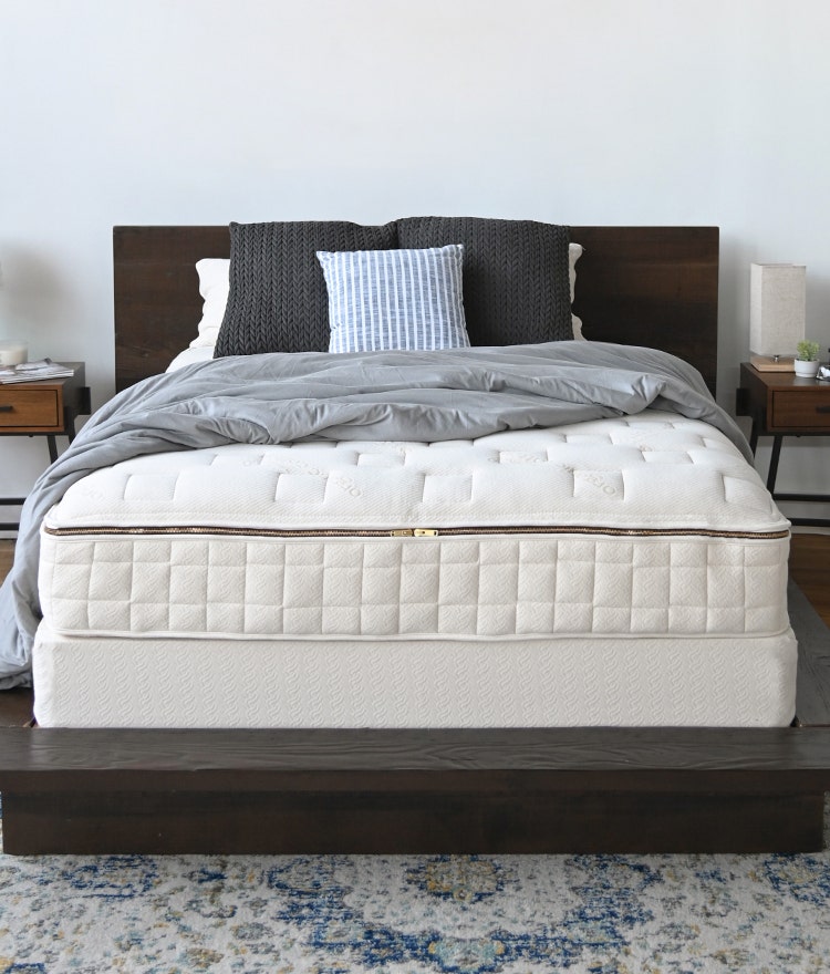 Naturepedic organic mattress in a clean, fresh bedroom