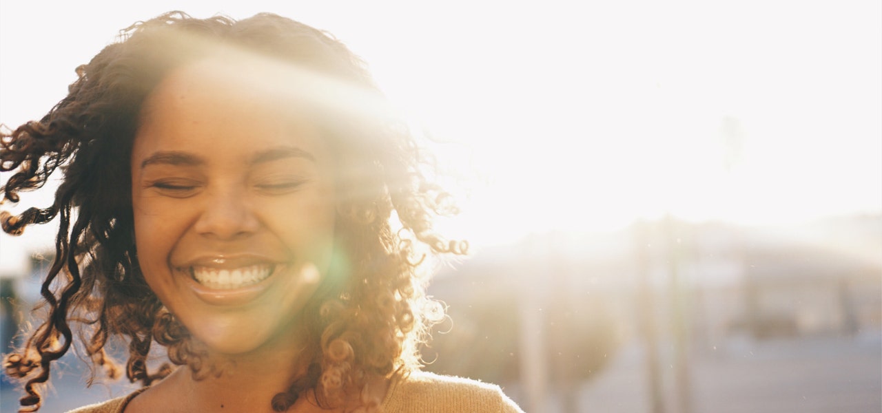 Healthy smiling woman enjoying the sunshine