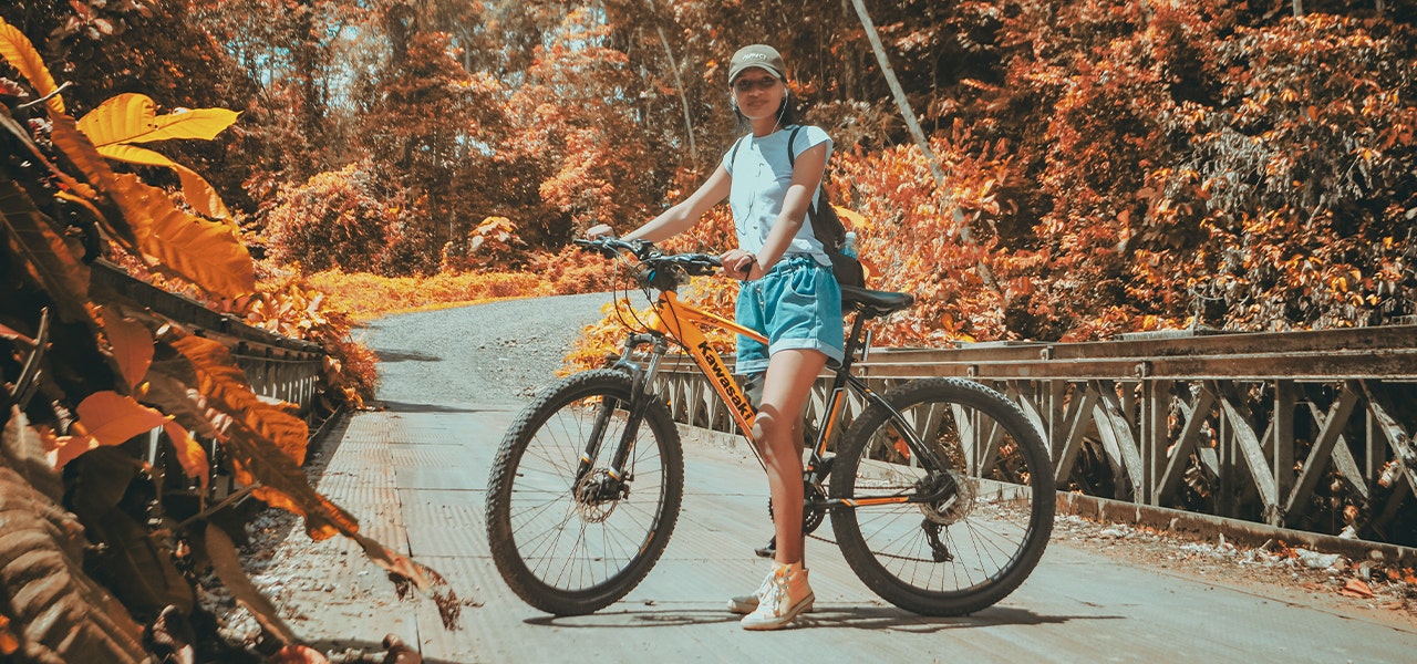 Woman outdoors, enjoying a fall bikeride