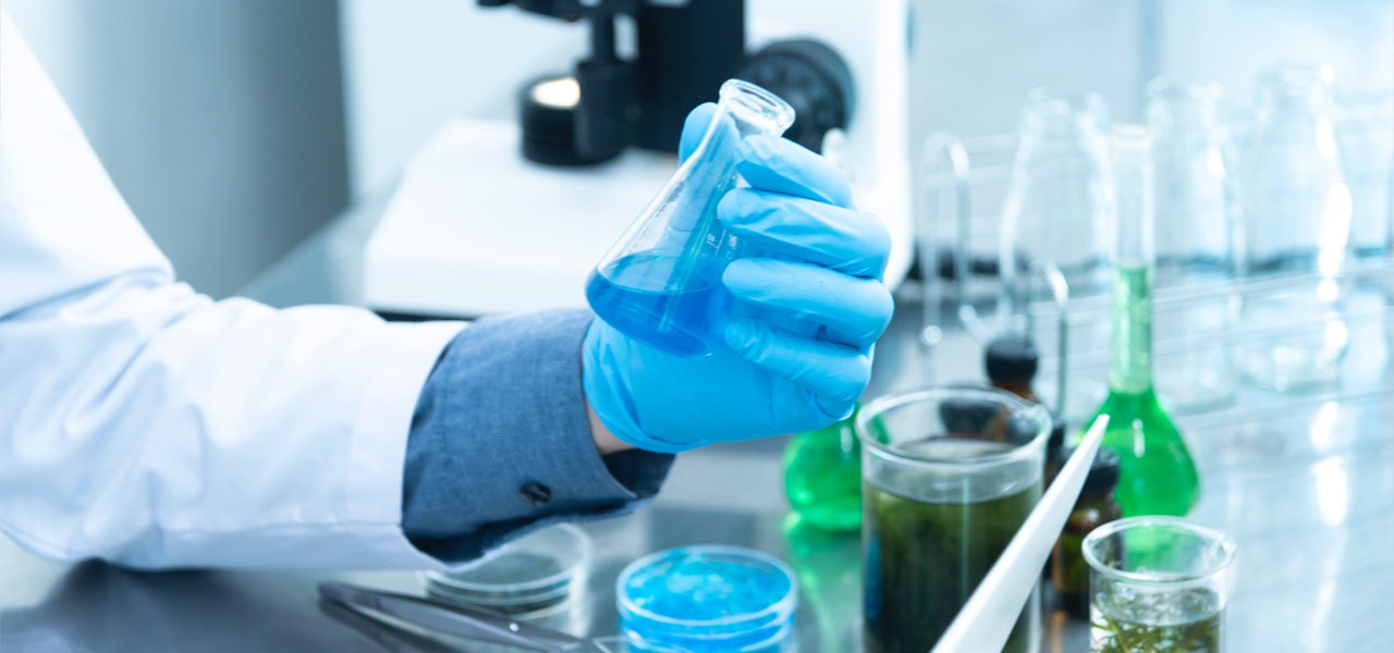 Scientist mixing chemicals in a laboratory