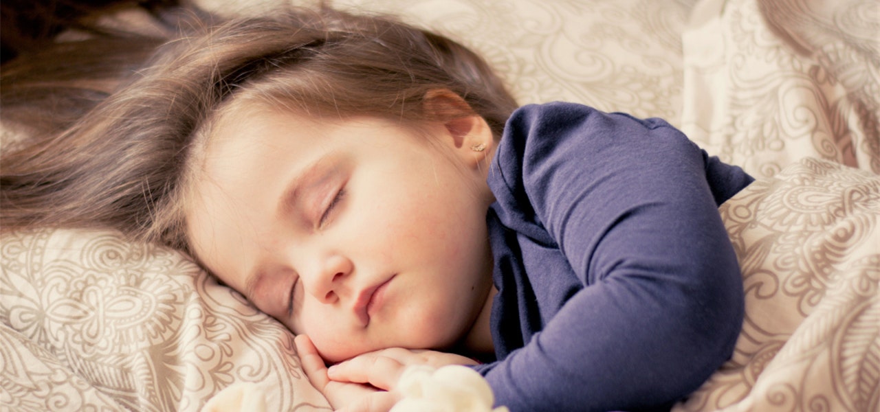 Young child sound asleep while away from home