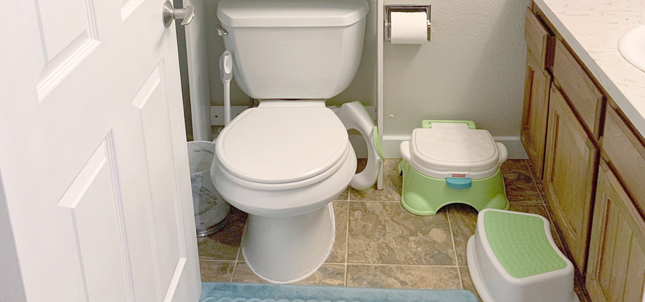 Child-proofed bathroom with potty chair and step stool