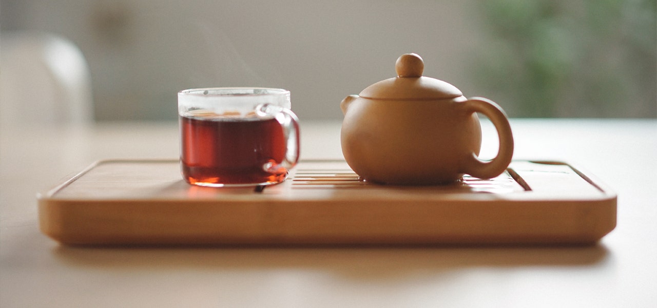 Wooden tea tray with pot and mug