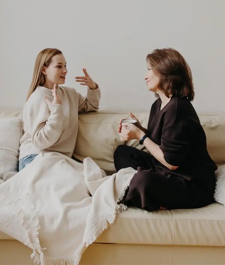 Parents and child talking on a mattress