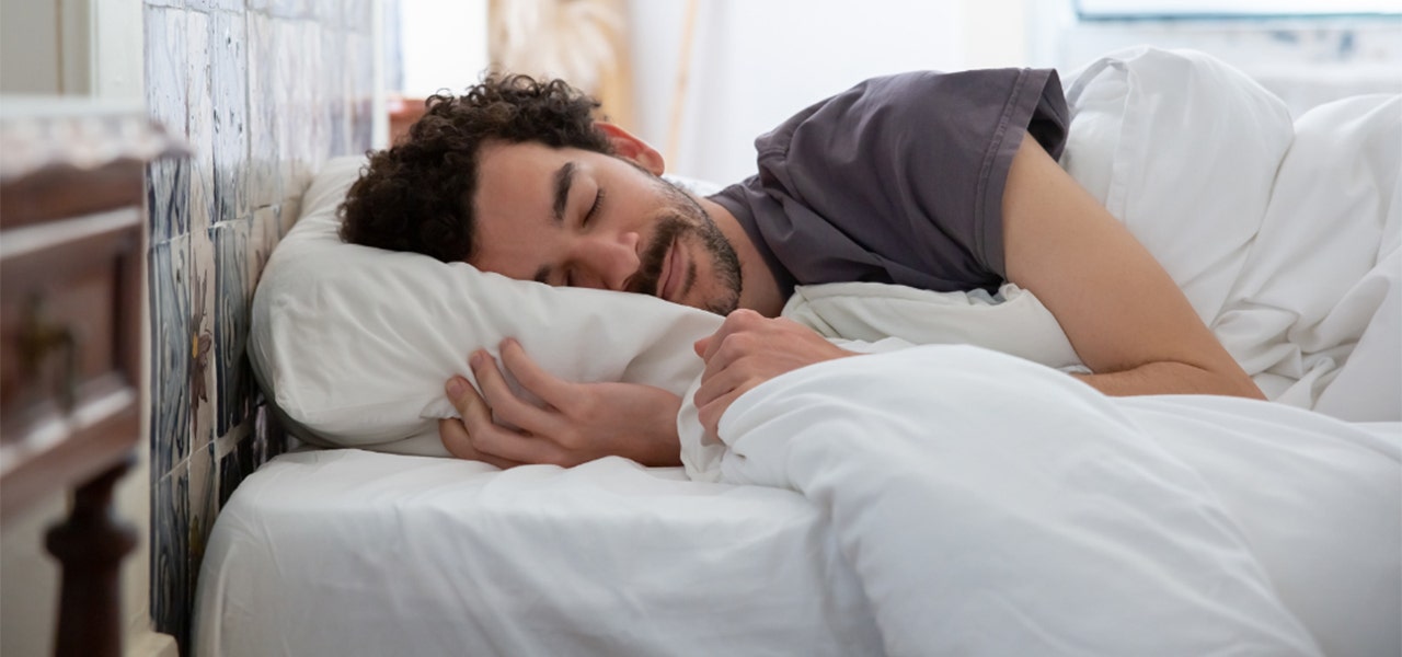 Man sleeping soundly on an organic, non-toxic mattress