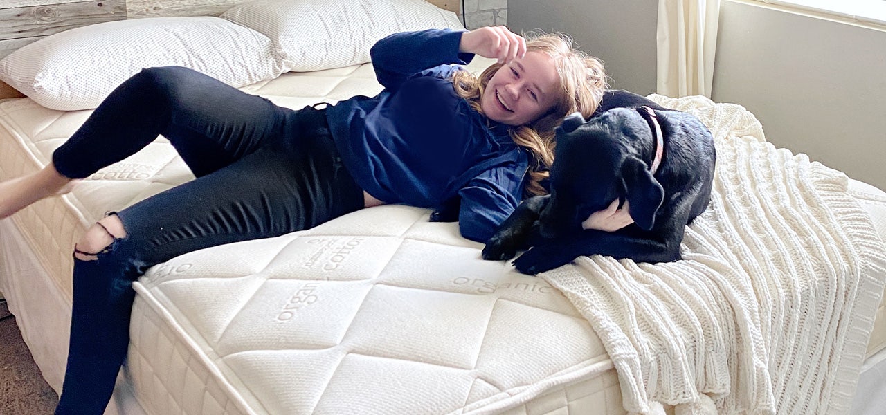 Teen girl and her dog, hanging out on her organic mattress