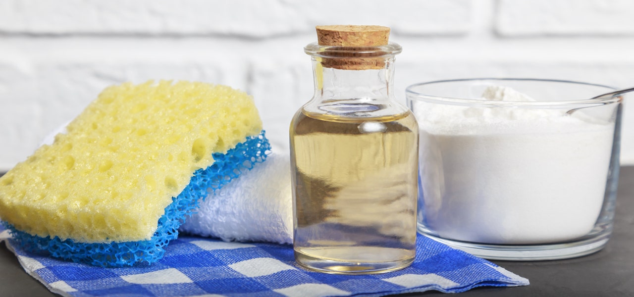 Vinegar, baking soda and a sponge to be used as a DIY cleaning option