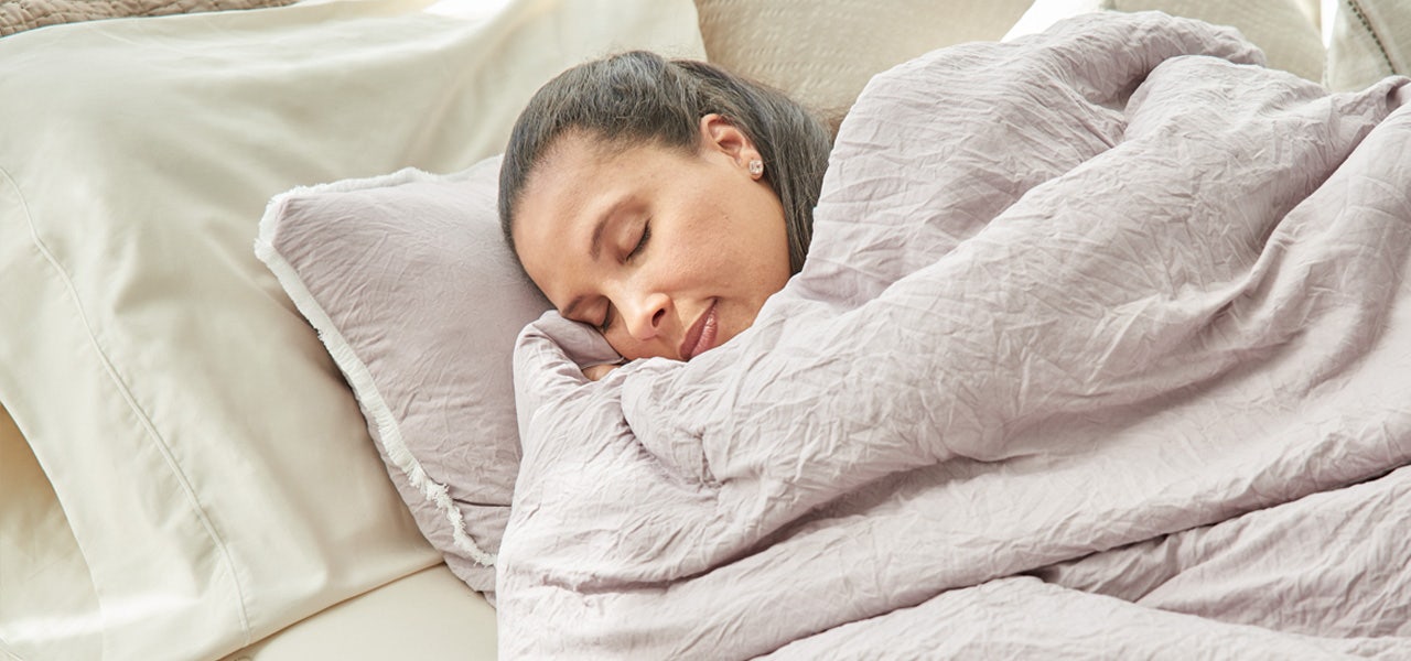 Woman sleeping soundly on a comfortable pillow