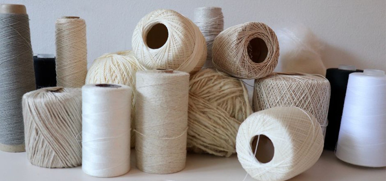 Spools of organic threads and yarns