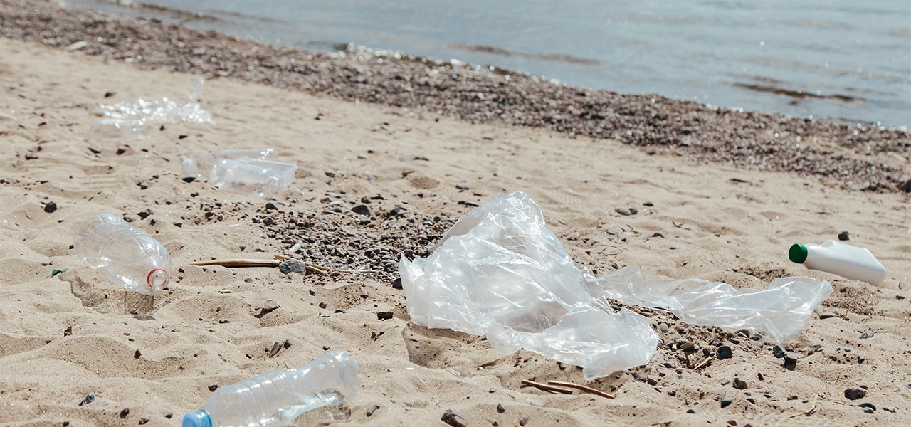 plastic packaging litter on a beach