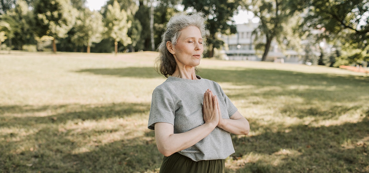 Woman practicing yoga outside