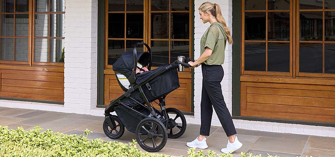woman pushing baby in stroller