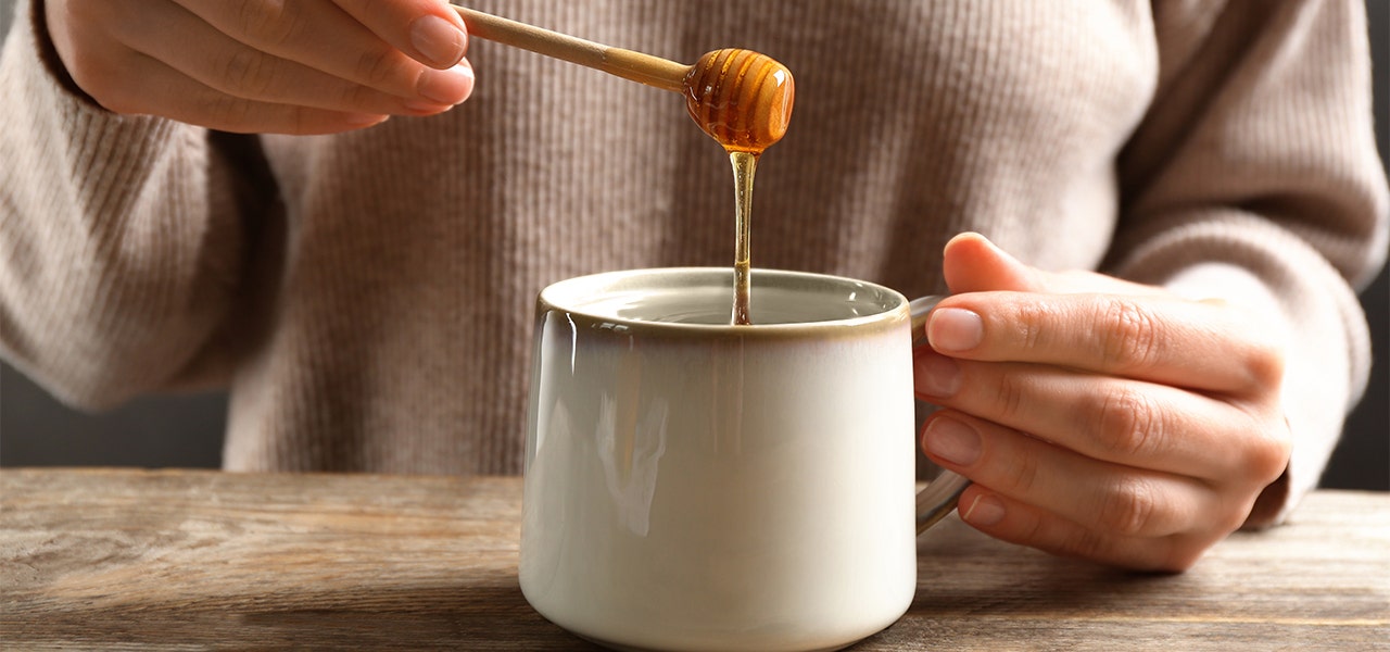 honey drizzled into a cup