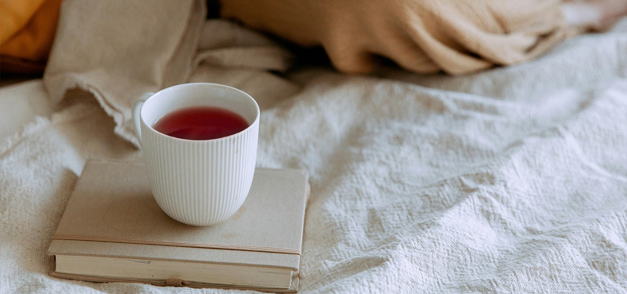 cup of red tea on a book