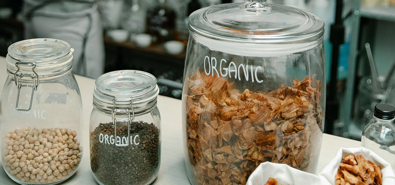 glass jars with food labeled as organic
