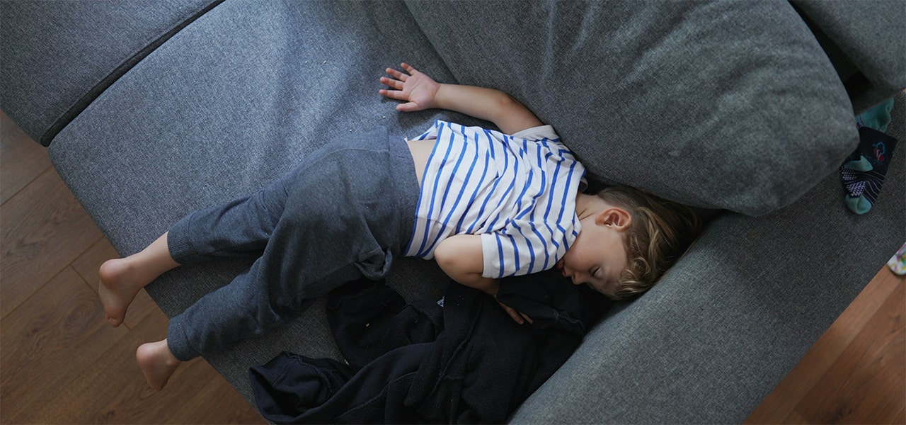 Child asleep on couch