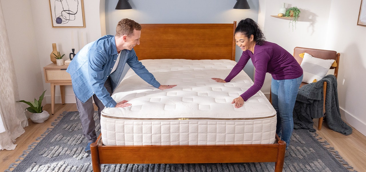 couple putting together customizable EOS organic mattress